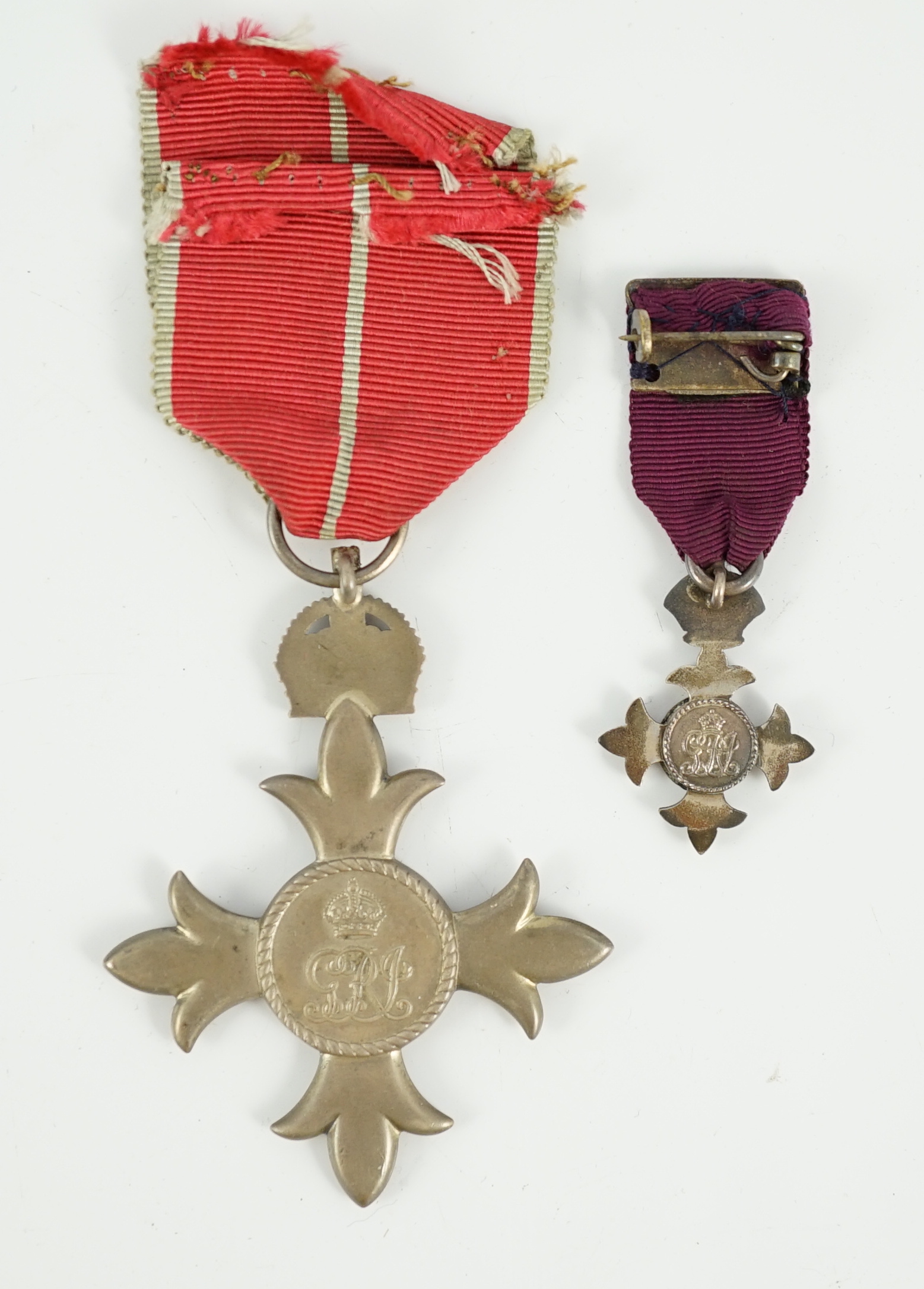 A cased George V military MBE containing leaflet with instructions as to wearing Insignia, together with the separately cased miniature